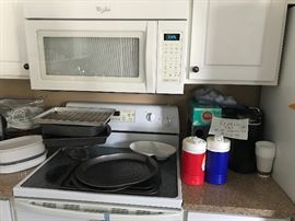 Kurig plus two side coffe pod holders, 3 unopened boxes of donut shop k cups 12ct and a bag of miscellaneous k cups. $100 for all.