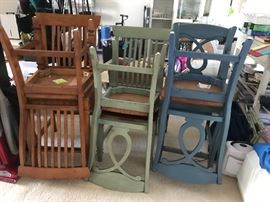 Eclectic but same collection of 4 chairs and 2 bar stools.