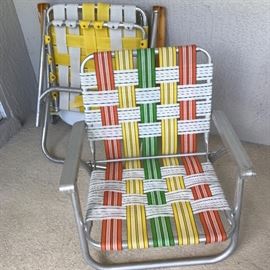 Folding Beach Chairs (webbing broken on yellow/white one in background)