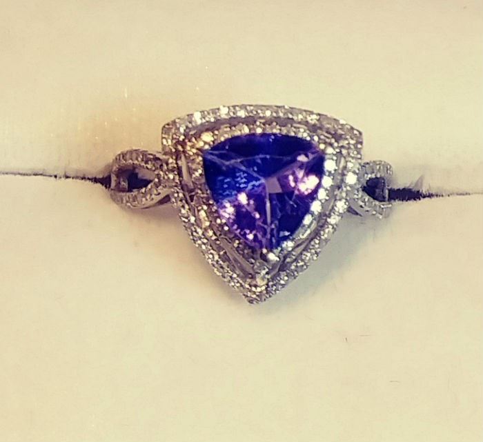 One stamped 18KT white gold cast triangular tanzanite and diamond double halo ring .  approx 2.00ct. center stone