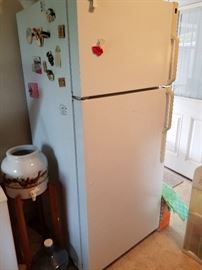 Nice refrigerator looks new and well cared for.  Nice vintage water cooler with 10 empty bottles. 