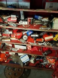 Parts cabinet filled with small parts. Spark plugs, gaskets, o-rings, so much more.
