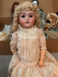 antique bisque porcelain head Doll with jointed leather body
