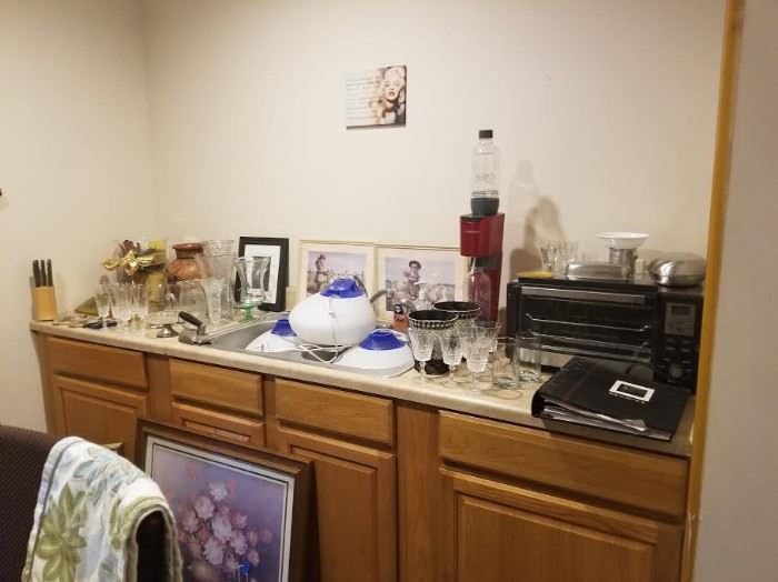 Soda stream machine, Krups toaster oven, wine glasses, knives in butcher block, recipes