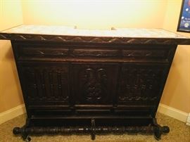 Carved wooden bar with marble top