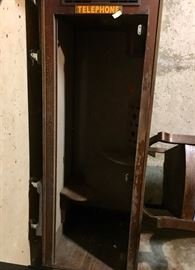 Telephone booth with glass doors
