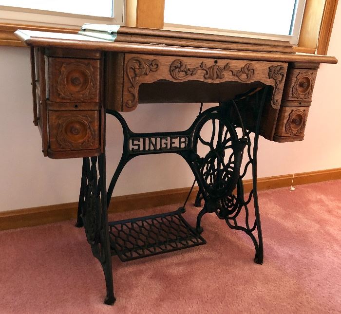 Beautifully restored antique Singer treadle sewing machine with original tiger oak table, drawers full of original hardware and pieces and parts ... Model Number 66-1 SN - HH446766. Early 20th c.
