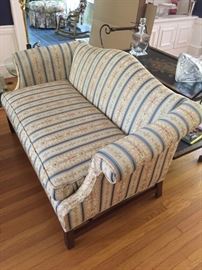 Upholstered love seat.
