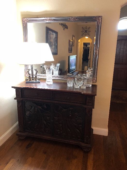 Howard Miller wine cabinet with large mirror above