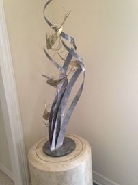 Travertine  pedestal and art sculpture