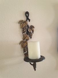 One of two candle wall sconces