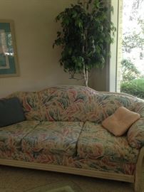 Lane rattan sofa sleeper; one of several ficus trees