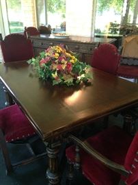 Exceptional antique walnut draw-leaf dining table and 6 chairs (one chair - as is)