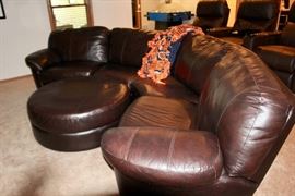 Buttery Leather Sectional Curved Sofa, with a comfy ottoman in the "Theater"