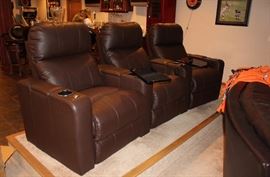 These are leather recliners for your theater seating. Nice chairs! they have tables attached for homework or eating!