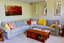 Family Room Sectional Sofa, from Pottery Barn, plus mission style side tables and cocktail table with storage, 3 neat mirrors on the walls, and the Art piece on the left there is amazing.