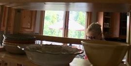 Terri hiding behin some stoneware bowls