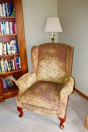 Upholstered chair, perfect for reading.