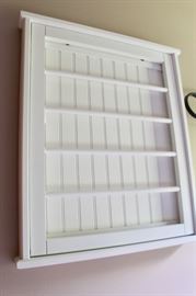 I believe this is a drying rack that opens up for air drying hand washables.