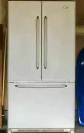 Refrigerator in the garage with the freezer below