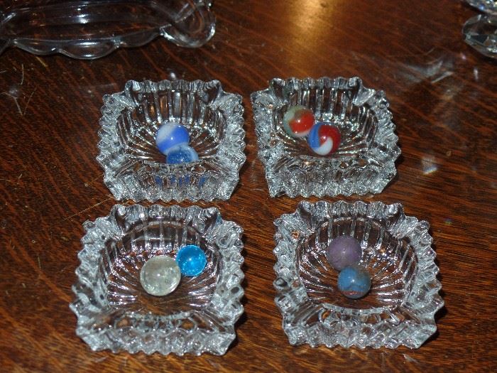 4 small glass ashtrays 