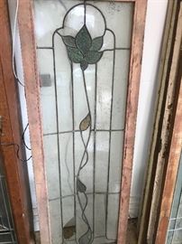Large assortment of stained glass windows and panels