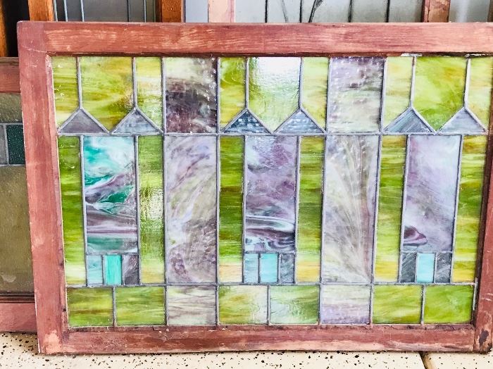 Large assortment of stained glass windows and panels