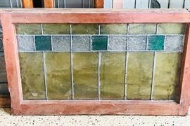 Large assortment of stained glass windows and panels