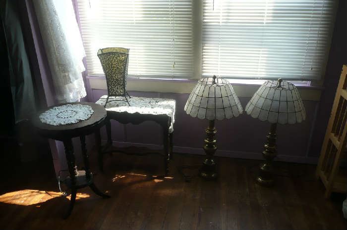 Antique wood tables, brass lamps