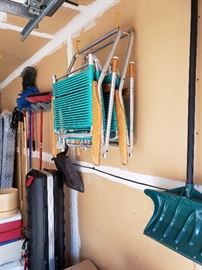 Garage tools; lawn chairs; traveling golf case.