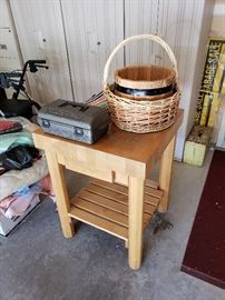 Butcher block; basket; wood pail; small yellowish wood stool with handle; garage sale signs.