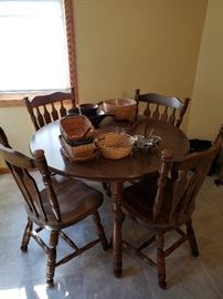 Kitchen table with 4 chairs and leaves.