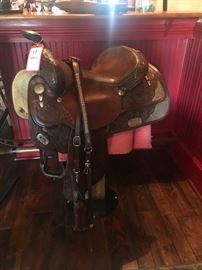 Lot 68: Circle Y Brand, TN Saddle with Silver Mounts on Stand
