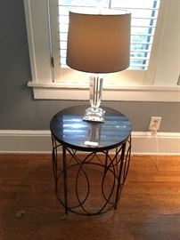Geometric metal and stone side table, glass lamp with shade