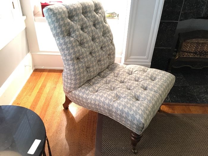 Tufted occasional chairs with front casters