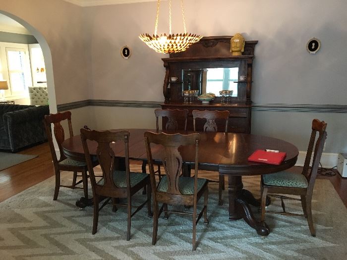 John Wanamaker dining room table with six chairs ($795), area rug, antique server