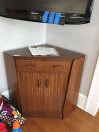 Unique mid-century corner cabinet. Would make a perfect little bar!