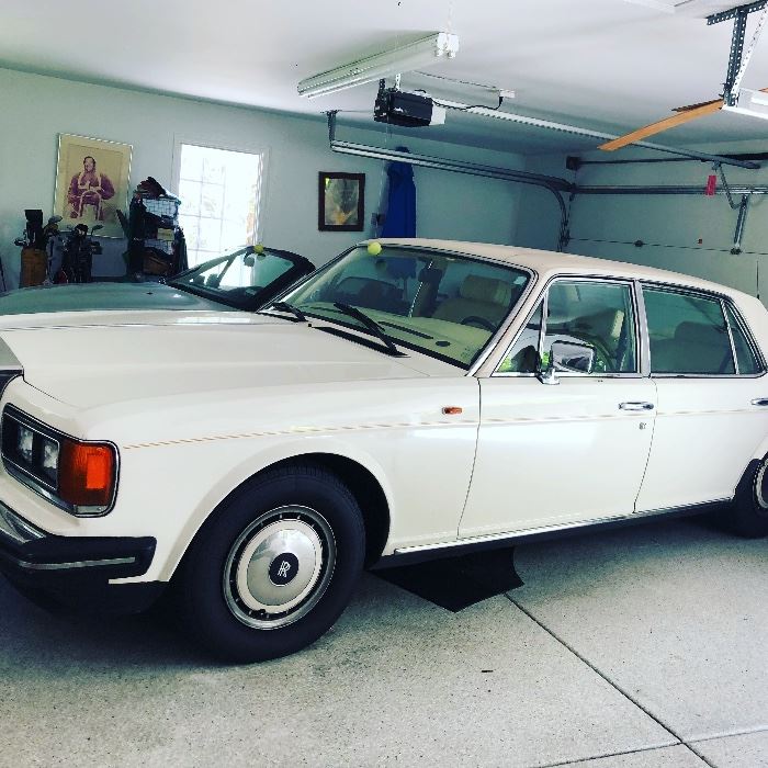 1991 Silver Spur Rolls Royce $20,000 - top of car has a few issues.  Probably needs upholstery work for the soft top - hence the price.  91,000
