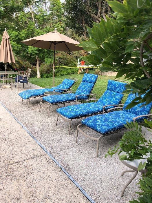 Patio table chairs with umbrella and lounge chairs
