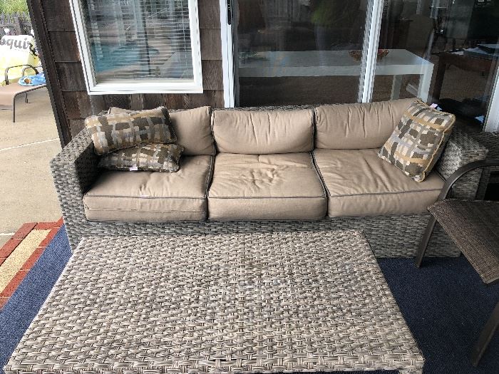 outside wicker  couch and coffee table