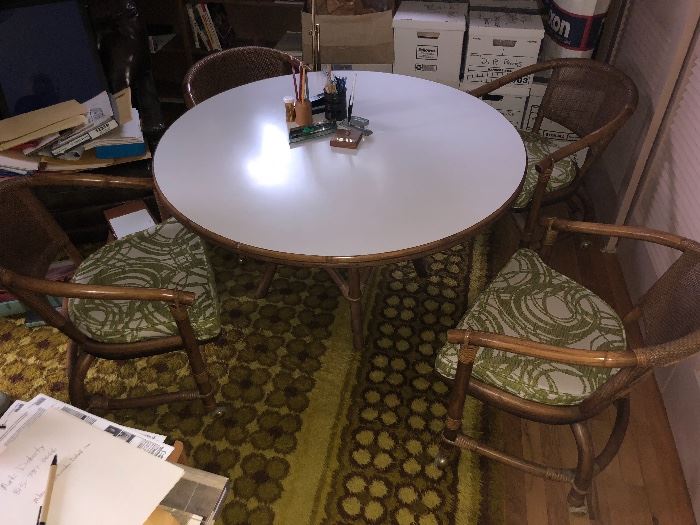 Vintage white top, round table with wood base. Comes with four comfortable cushioned chairs on wheels.  Prefer to sell together as a set.  Excellent condition. 
