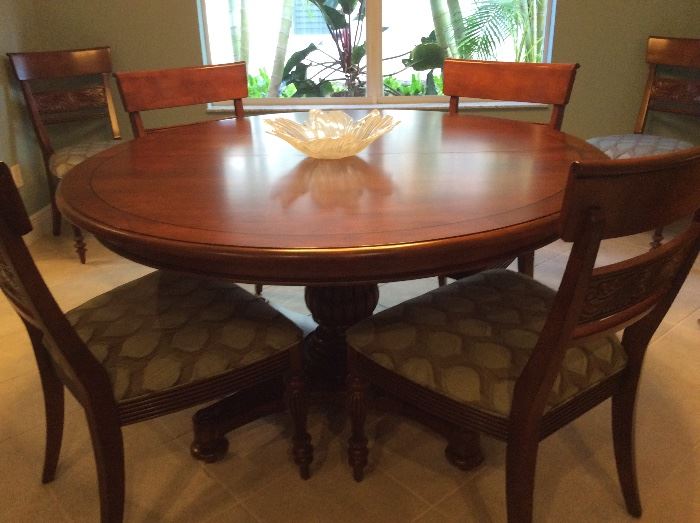 Ethan Allen walnut dining room; 56' round pedestal table with 20" leaf & 6 carved upholstered side chairs
