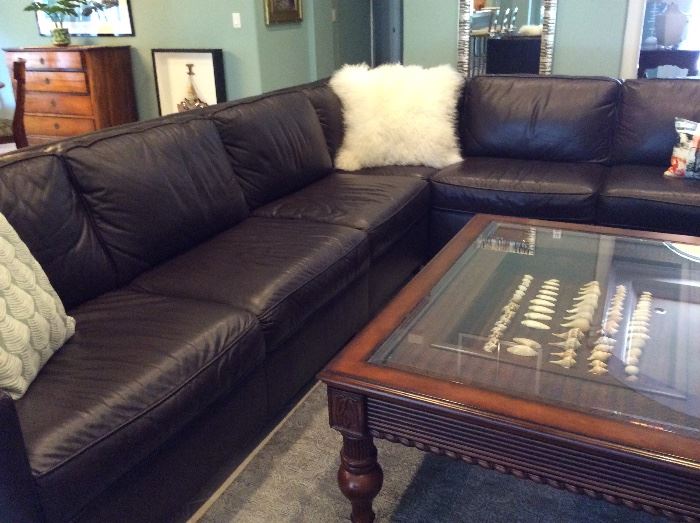 West Elm dark brown leather sectional. Measures 8' x 11'