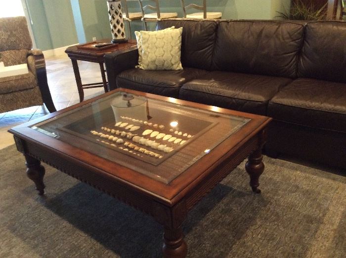 Haverty's wood coffee table with glass top & custom shadow box. Measures 36" x 49" (shells not included)