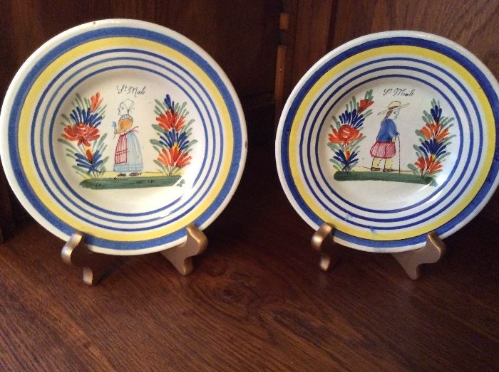 Pair of antique French faience plates depicting man and woman from St. Malo, France  Marked "PB" on back