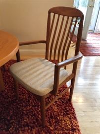 Benny Linden BL10 upholstered teak dining chairs. There are 2 captains chairs & 6 side chairs.