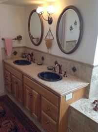 sinks are kohler; serpentine bronze-- retails at $1400 each! Altman copper finish faucets. 36" oak vanities