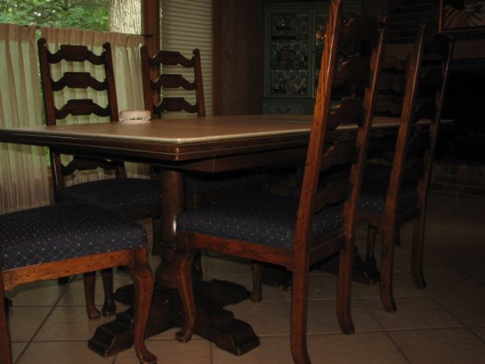dual pedestal dining table with ladderback chairs