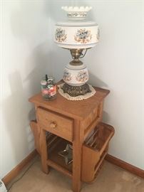 small wooden table/magazine rack with drawer; hurricane lamp