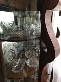 The ABP glass collection in an Oak bentwood and curved glass serpentine china cabinet in the Arts and Crafts antique style. 